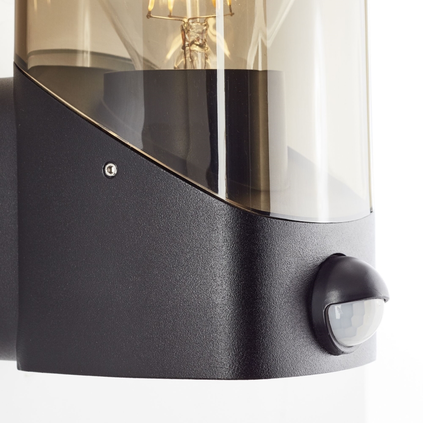Brilliant - Aplique para exterior con sensor MINOU 1xE27/10W/230V IP44 negro/ahumado