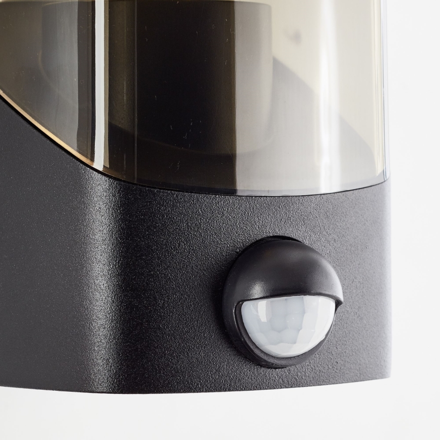Brilliant - Aplique para exterior con sensor MINOU 1xE27/10W/230V IP44 negro/ahumado