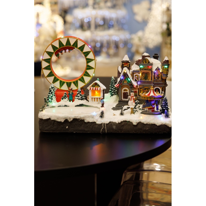 Decoración navideña animada LED RGB con música 30xLED/1,5W/230V pueblo nevado