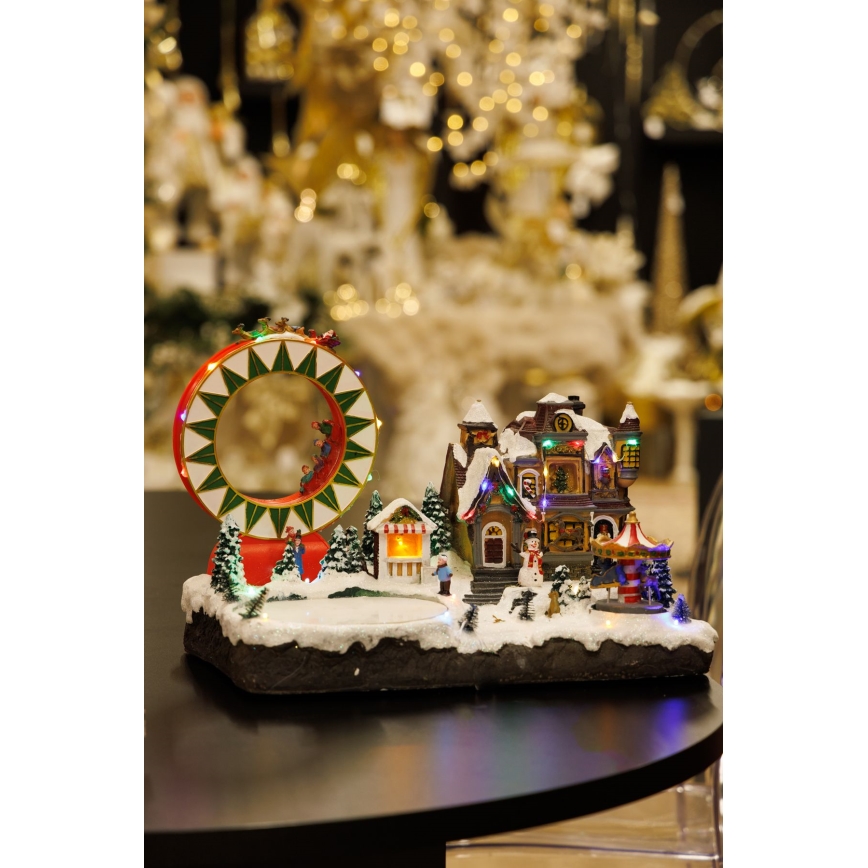 Decoración navideña animada LED RGB con música 30xLED/1,5W/230V pueblo nevado
