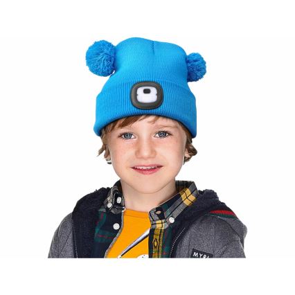 Extol - Gorra con linterna frontal y carga USB 250 mAh azul con pompones talla infantil