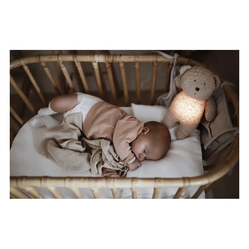 Moonie - Pelele con melodía y luz, pequeño oso de miel orgánica en tono rosado natural