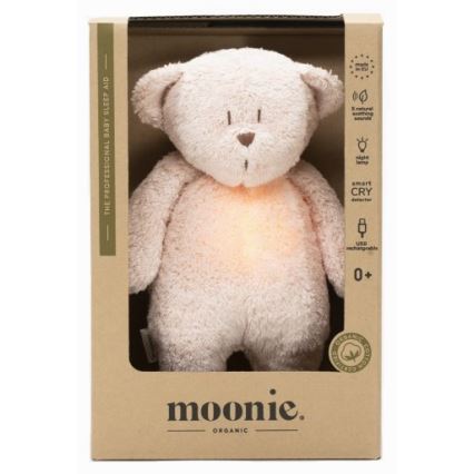 Moonie - Pelele con melodía y luz, pequeño oso de miel orgánica en tono rosado natural