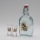 Set 1x botella de vidrio y 2x Vaso de chupito transparente con un motivo de liebre